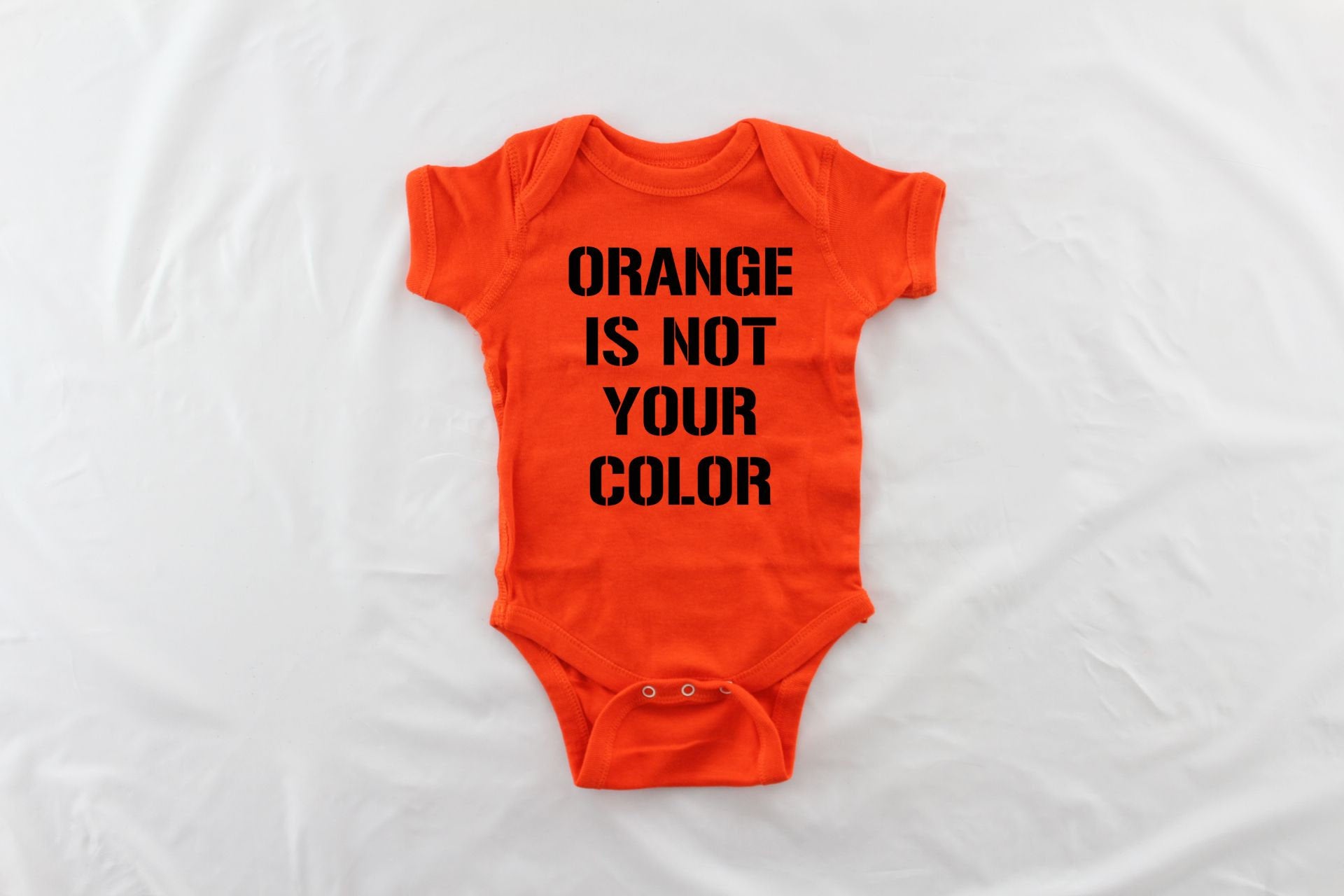 infant orange shirt