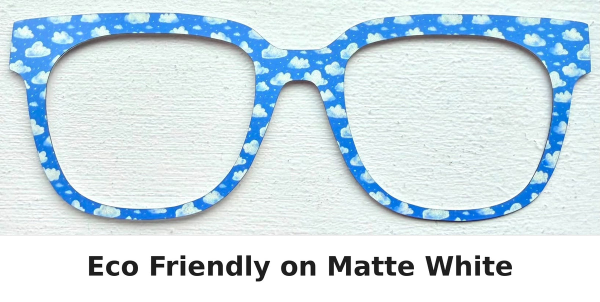 Blue and white cloud-patterned eyeglass frames shown against a white textured background, with the text 'Eco Friendly on Matte White' below.