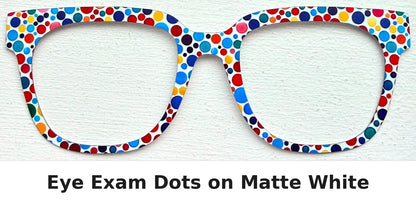 Glasses-shaped matte white item decorated with colorful eye exam style polka dots, shown on a white textured background with the text 'Eye Exam Dots on Matte White' below.